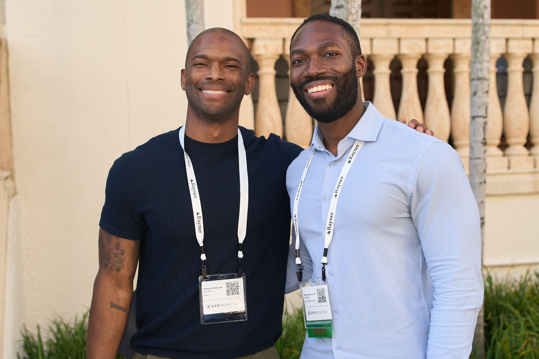 Two residents smiling together at the outdoor reception