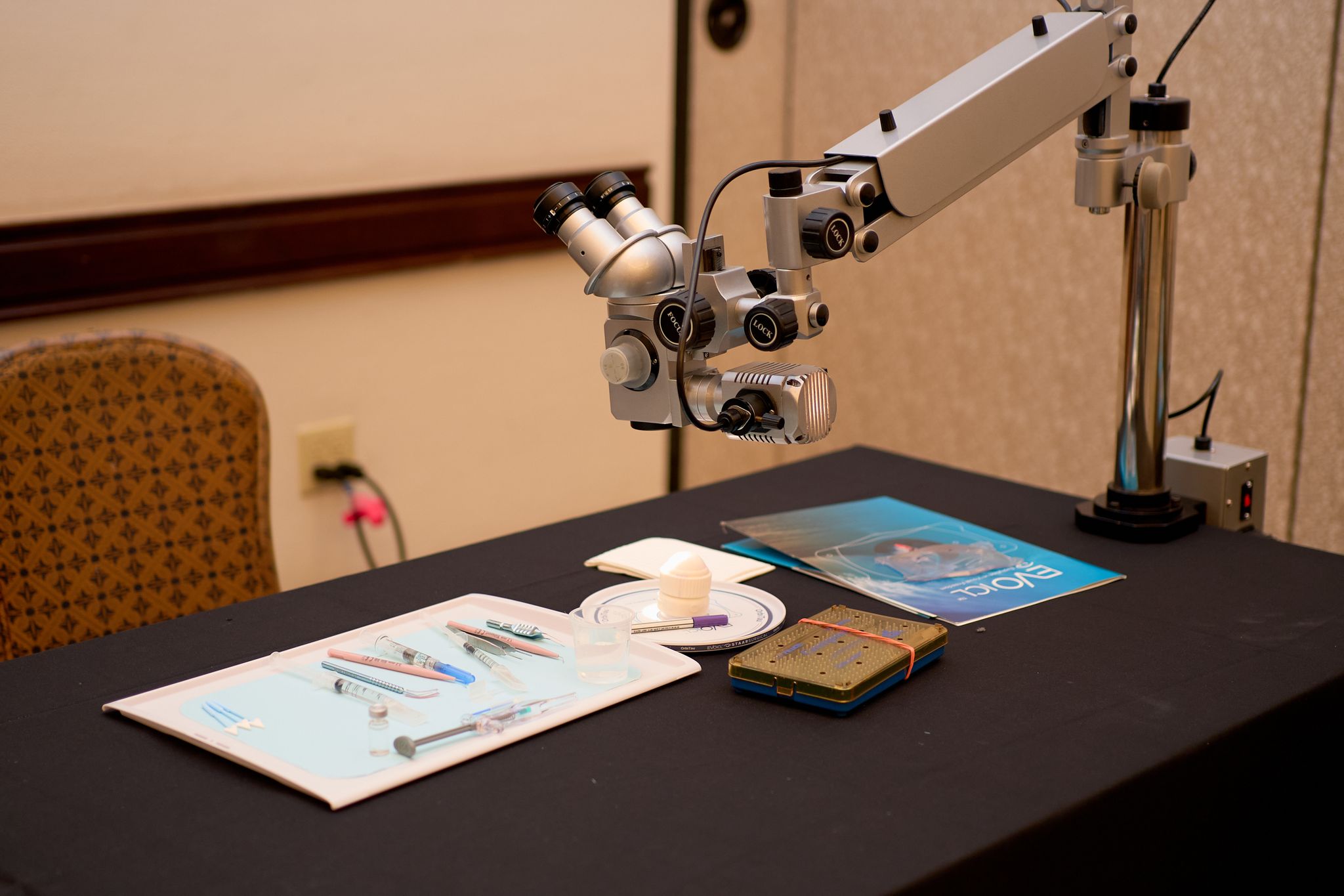 Surgical microscope and instruments set up at a wet lab station