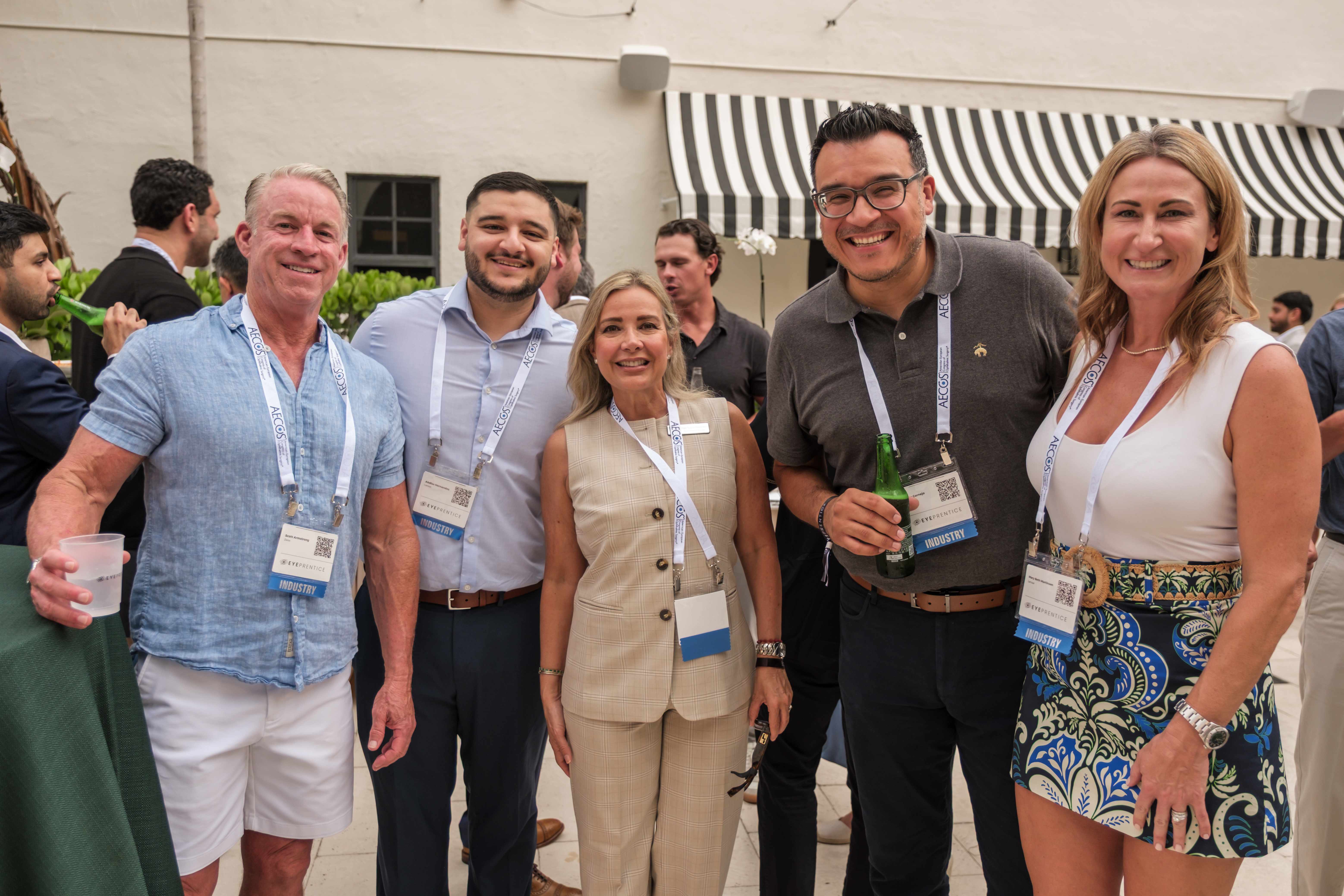 Attendees mingling at a courtyard reception at the Boca Raton