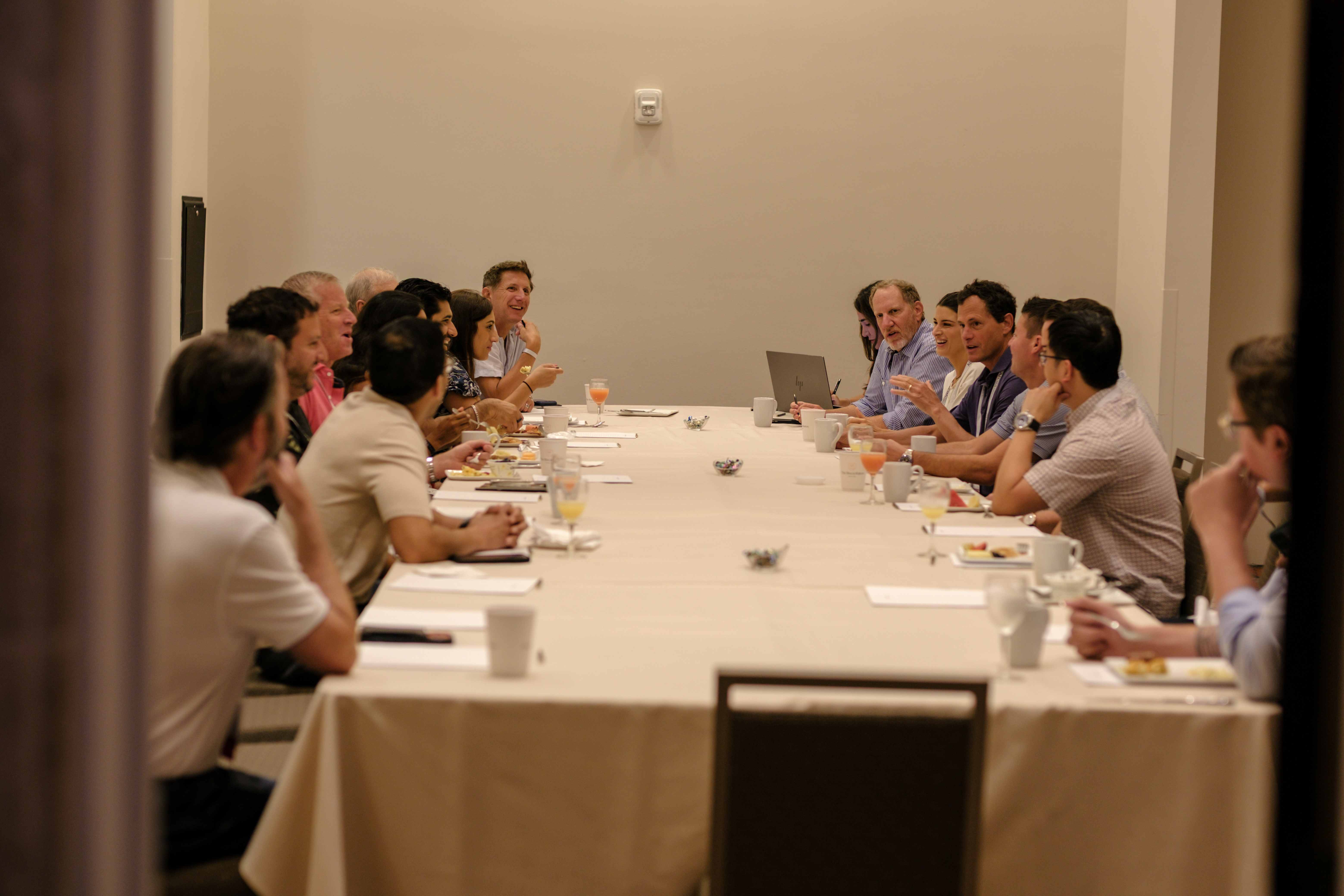Residents and faculty in conversation at a breakfast roundtable